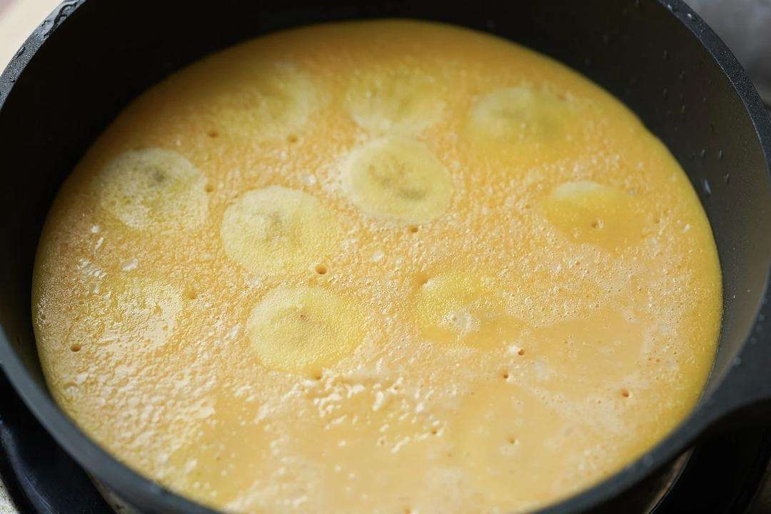 Cover the pan and cook on the lowest heat for about 5 minutes so the pancake steams and rises.