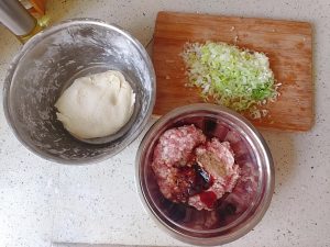 Mix the flour with boiling water, then warm water, and knead ten minutes