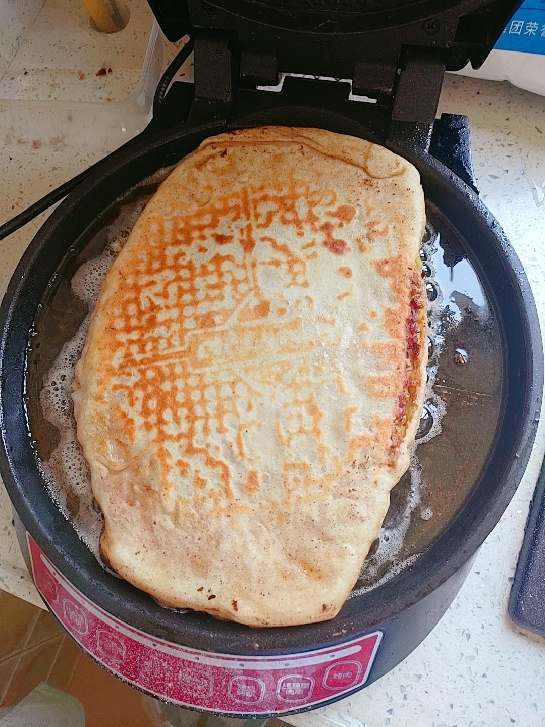 Roll the filled dough up into a layered towel-shaped tower