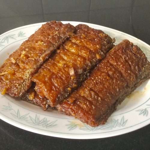 Sweet and sour braised hairtail pieces glazed in a glossy vinegar sauce