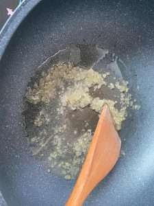 Melt the rock sugar over low heat into amber caramel for the color