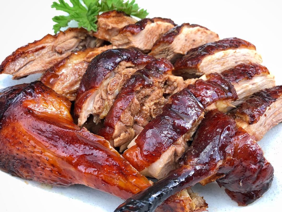 Whole roasted Cantonese duck with glossy mahogany skin