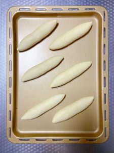 Arrange the buns on the lined tray and proof, covered, until doubled in size.