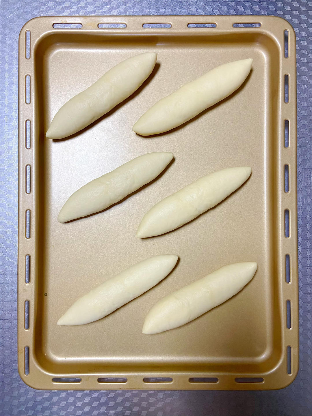 Arrange the buns on the lined tray and proof, covered, until doubled in size.