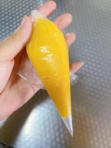 Let the cheese sauce cool until thick, then spoon it into a piping bag and set aside.