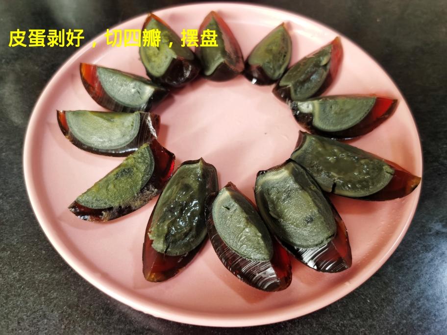 Peel the preserved eggs, cut each into quarte