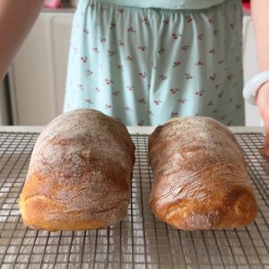 The loaves are ready when the crust is a deep, even gold and tapping the bottom sounds hollow.