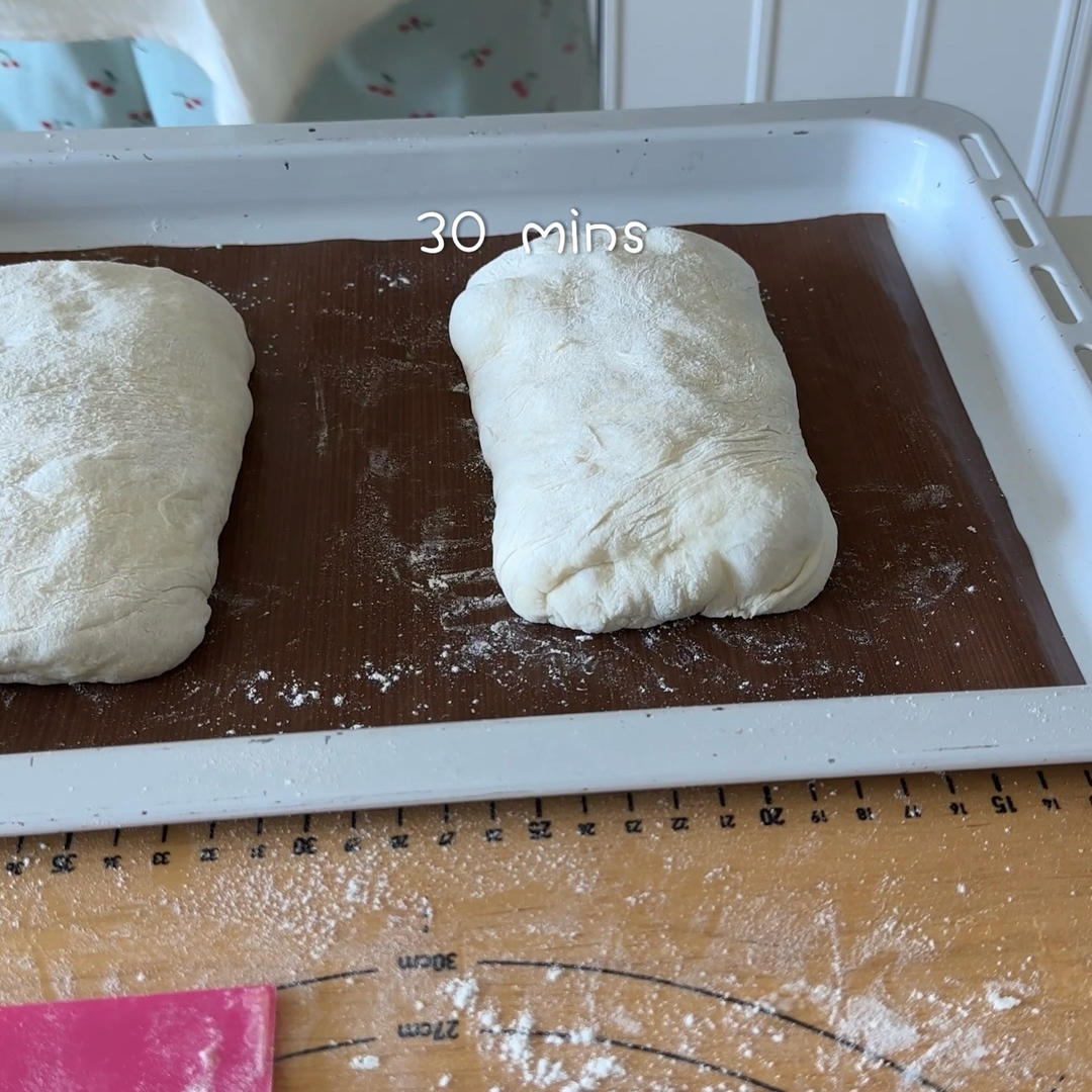 Place the loaves on a floured tray, cover, and proof for 30 minutes while the oven preheats to 230 degrees C.