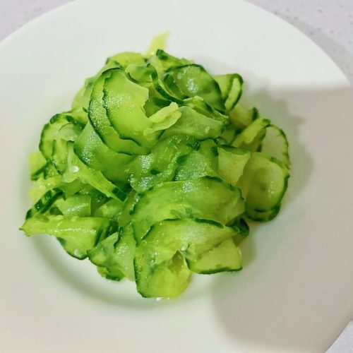 Cold cucumber slices tossed with garlic and chili oil