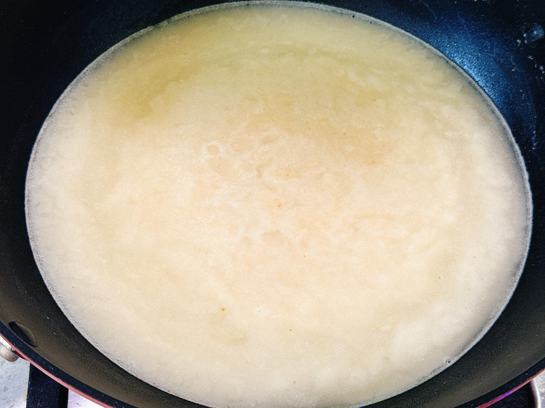 Add water, stirring gently as it heats, until