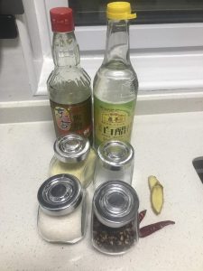 Add the soy, vinegar, sugar, chilies, and peppercorns