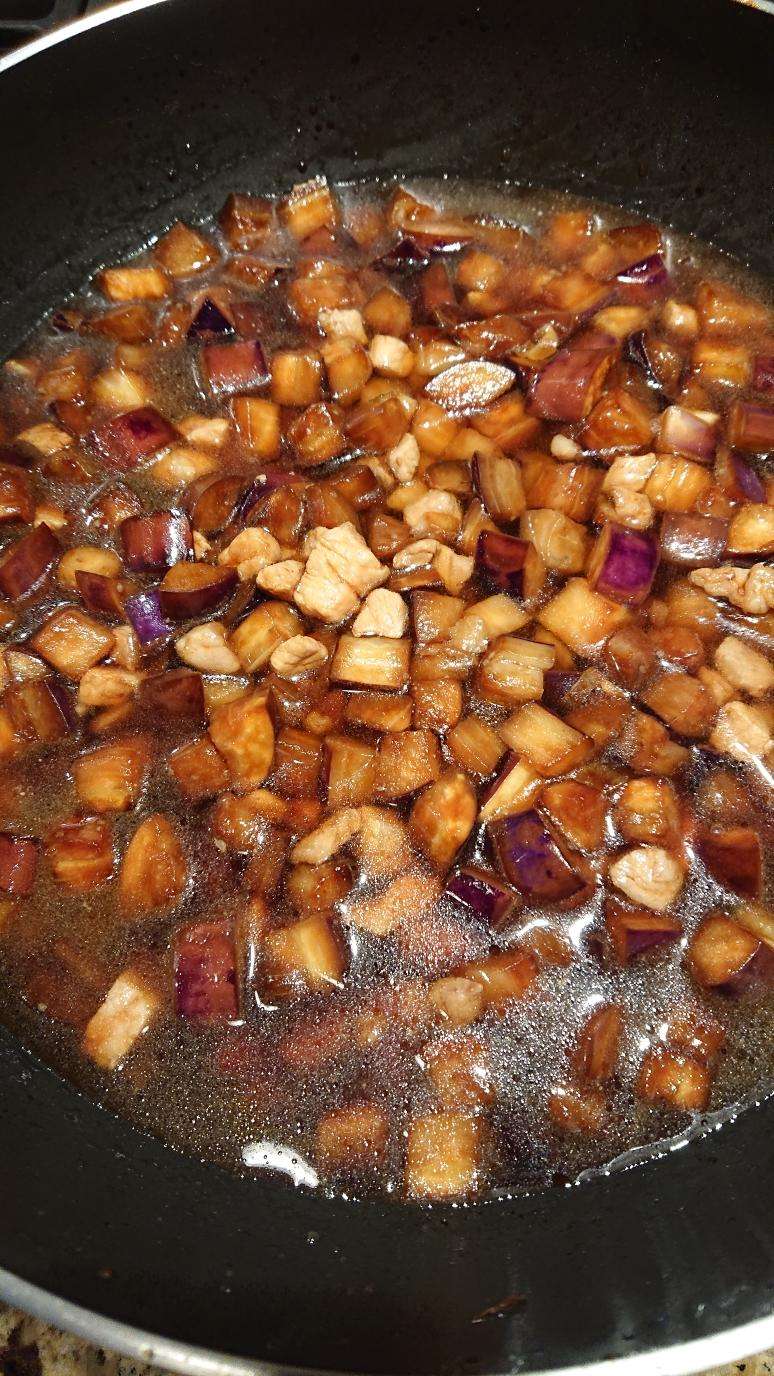 Add water to cover the eggplant and pork, cover, and simmer over medium heat