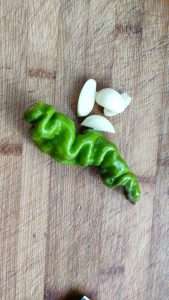 Slice the chilies fine and mince the garlic finer — fried rice needs few aromatics.