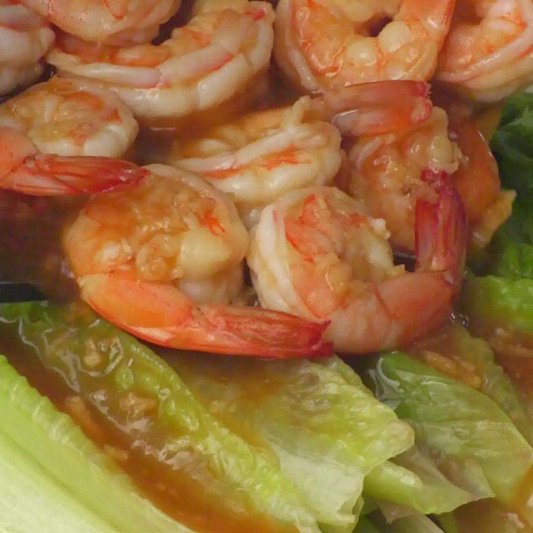 Spoon the shrimp and sauce over the blanched lettuce and serve immediately