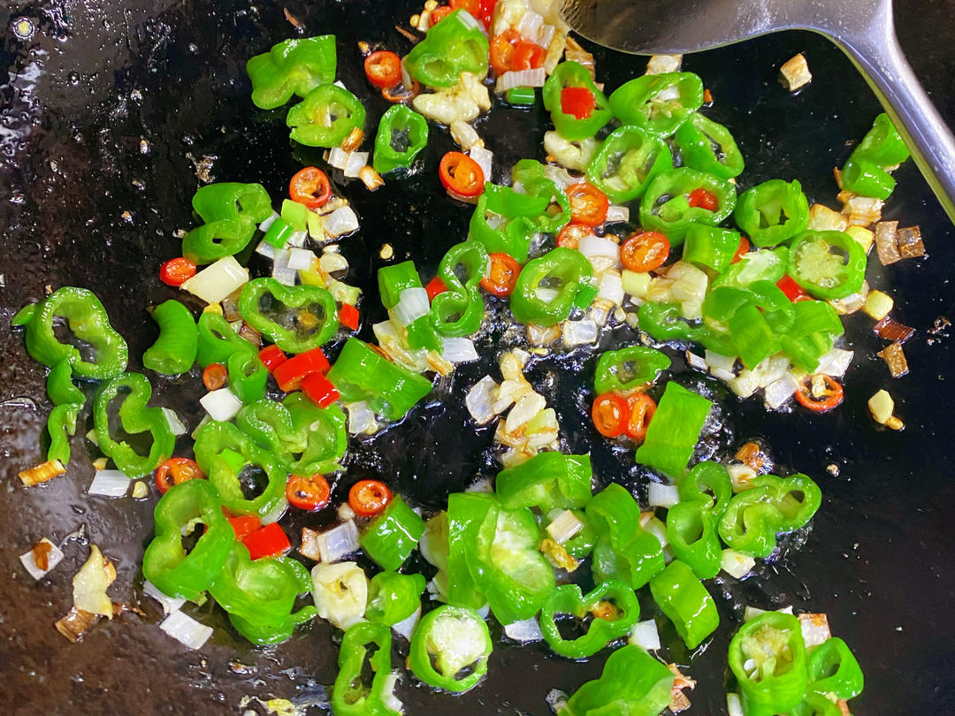 Using the egg oil, stir-fry all the diced veg