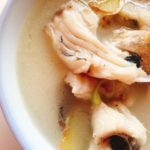 Milky white grass carp and tofu soup in a bowl