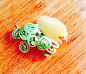 Slice the ginger and cut the scallions