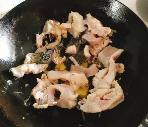 Pan-fry the fish chunks until both sides are golden