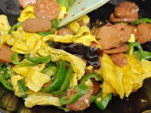 Add the dark soy and oyster sauce