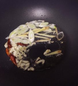Bloom the aromatics, then add the scallops