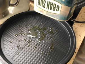Lay the first slice of bread in the griddle