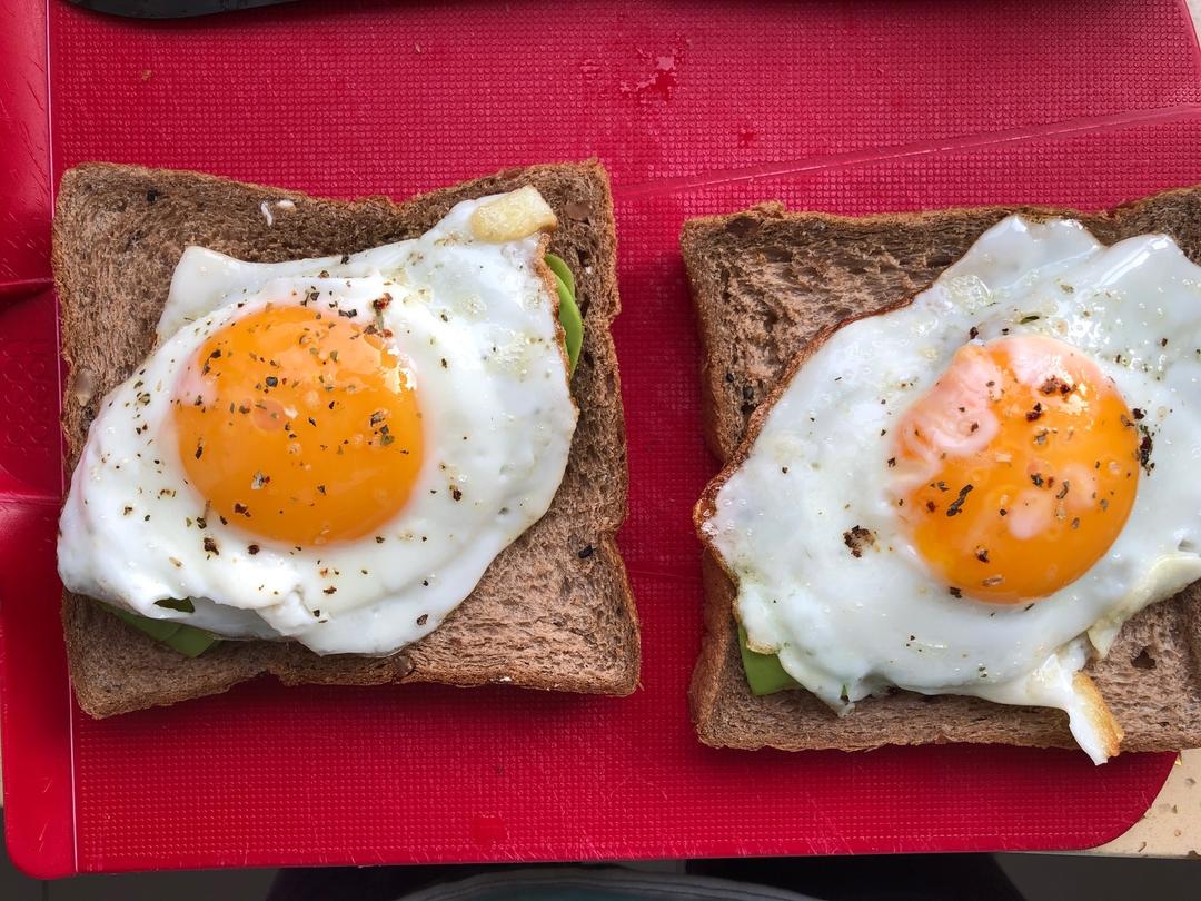 Lay avocado slices on one slice of toast, top