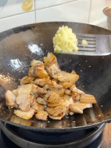 Add half of the minced garlic and fry until golden.
