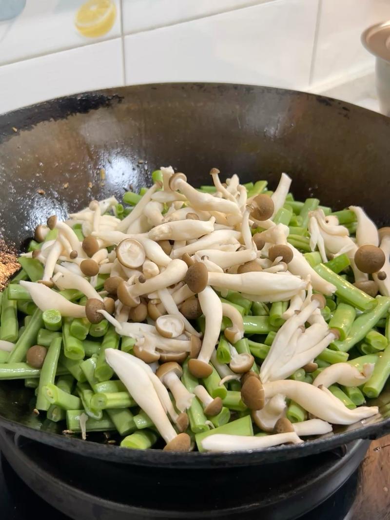 Add the beech mushrooms for texture and umami, and fold everything together.