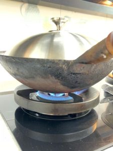 Cover the wok and braise over medium-high heat for 8 to 10 minutes.