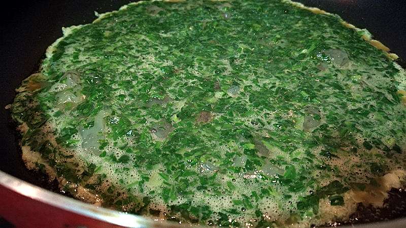 Heat oil in a wok and pour in the egg mixture, scrambling gently as it sets.