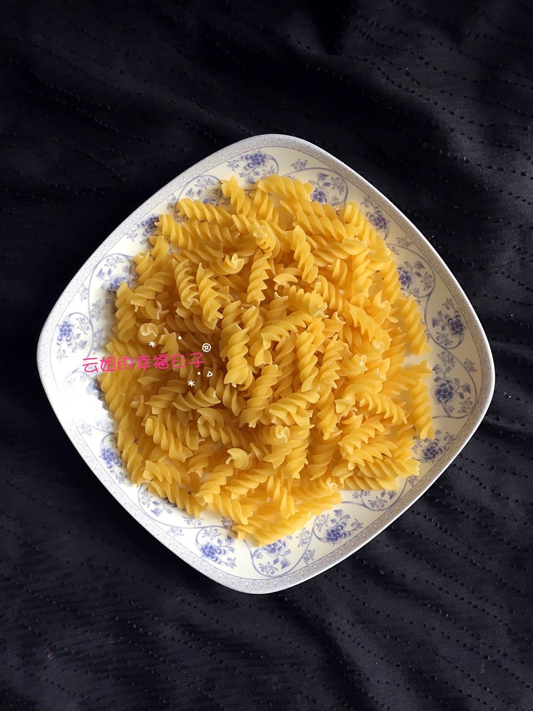 Measure a serving of spiral pasta