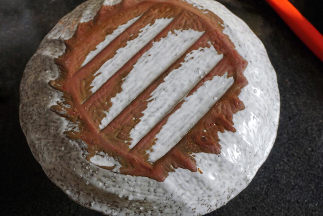 Cover the bowl with a serving plate, hold both together and flip to invert the kou rou onto the plate.
