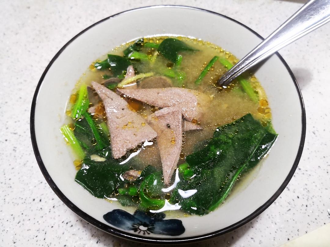 Add the blanched spinach, then the liver. Cook until the liver turns pale and opaque, about 45 seconds to 1 minute. Finish with a few drops of sesame oil.