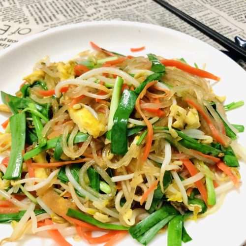 Colorful stir-fried mixed vegetables with bean sprouts, carrot, egg, and chives