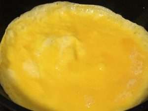 Cook a thin egg omelet and cut it into ribbons