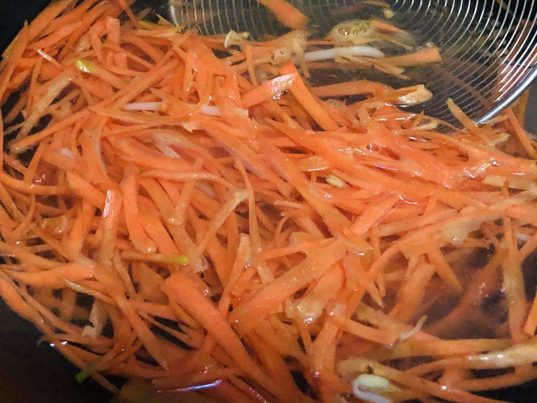 Blanch the julienned carrot in boiling water for one minute