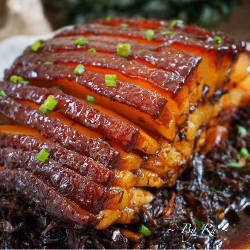 Classic mei cai kou rou - braised pork belly with preserved mustard greens, blistered skin and glossy sauce