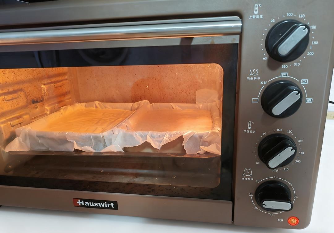 Set the pans in the oven and bake at 130 degrees C for 60 minutes, resisting the urge to open the door.