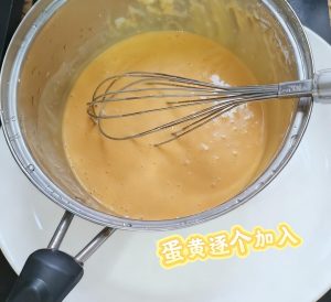 Add the yolks one at a time, mixing until smooth after each addition, then strain the batter once and chill it in the fridge.