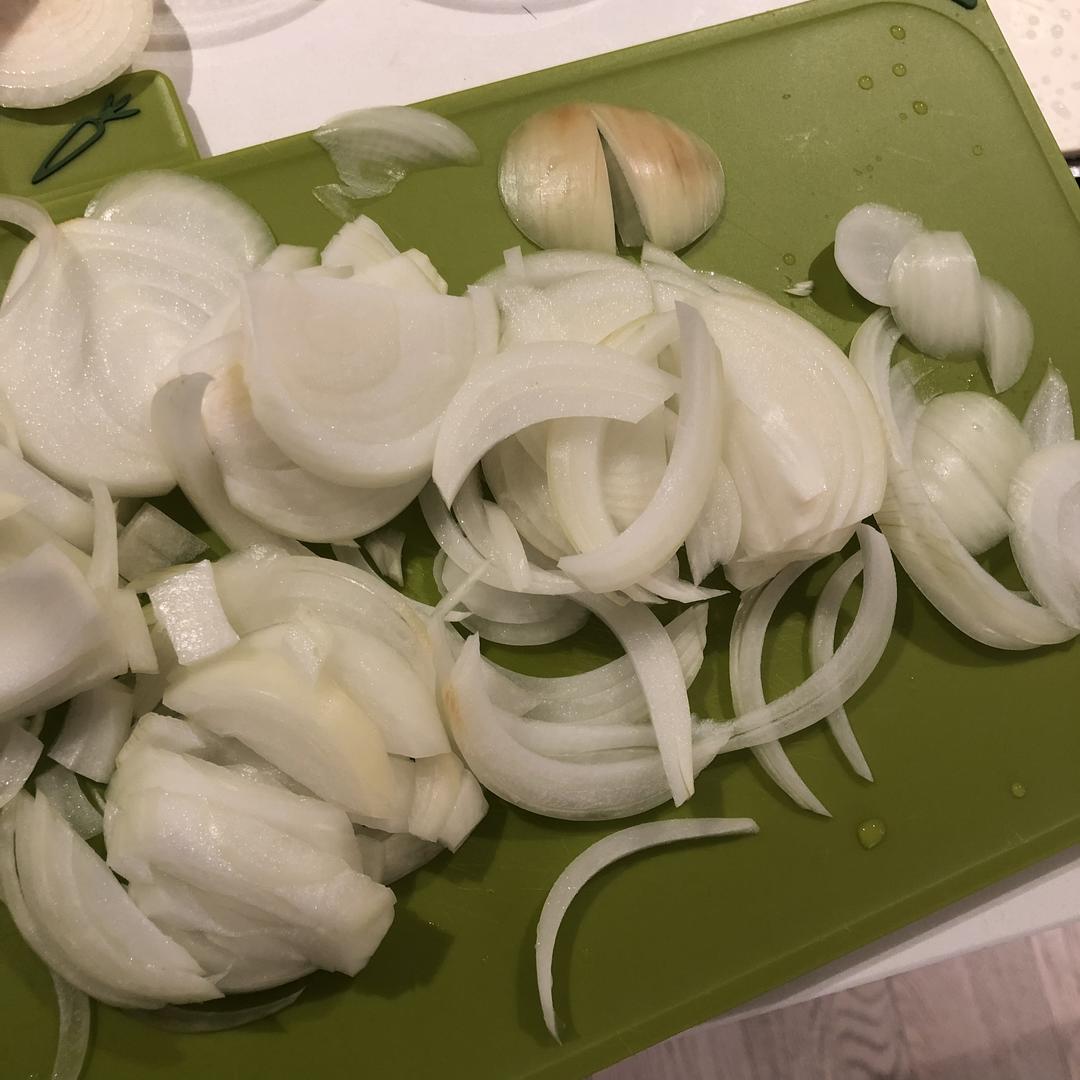 Slice one onion into thin half-moons.