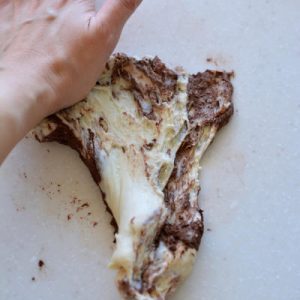 Mix the cocoa powder with a little water and knead it into the 130 g portion until the color is even.