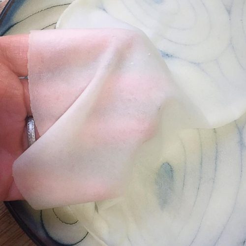 A stack of paper-thin steamed spring pancakes