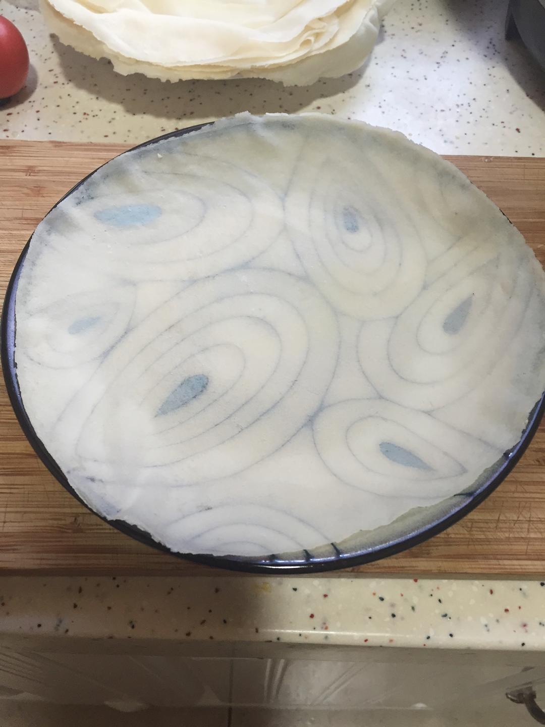 The plate pattern is clearly visible through the thin pancake