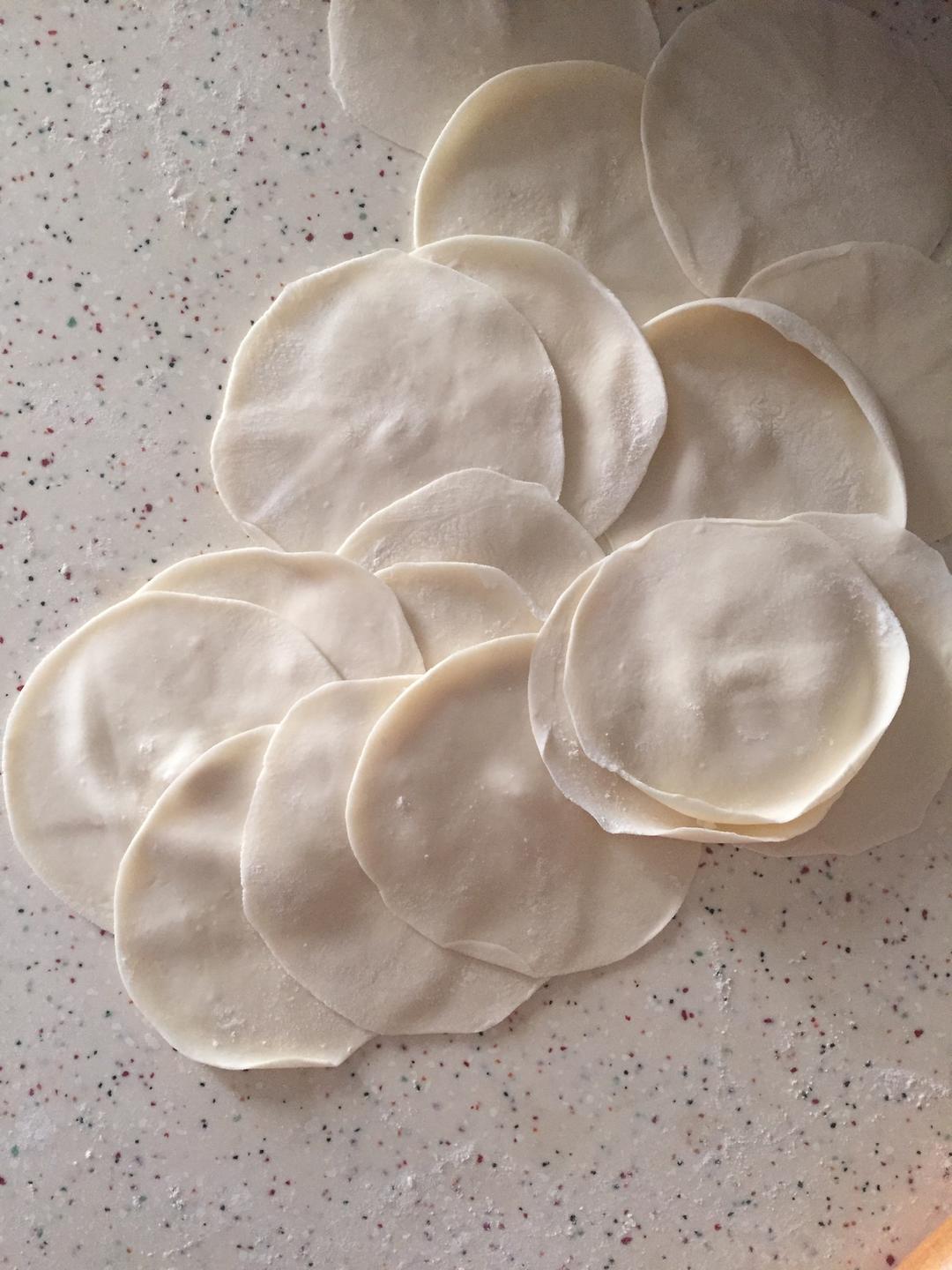 Roll each dough ball into a thin round wrapper