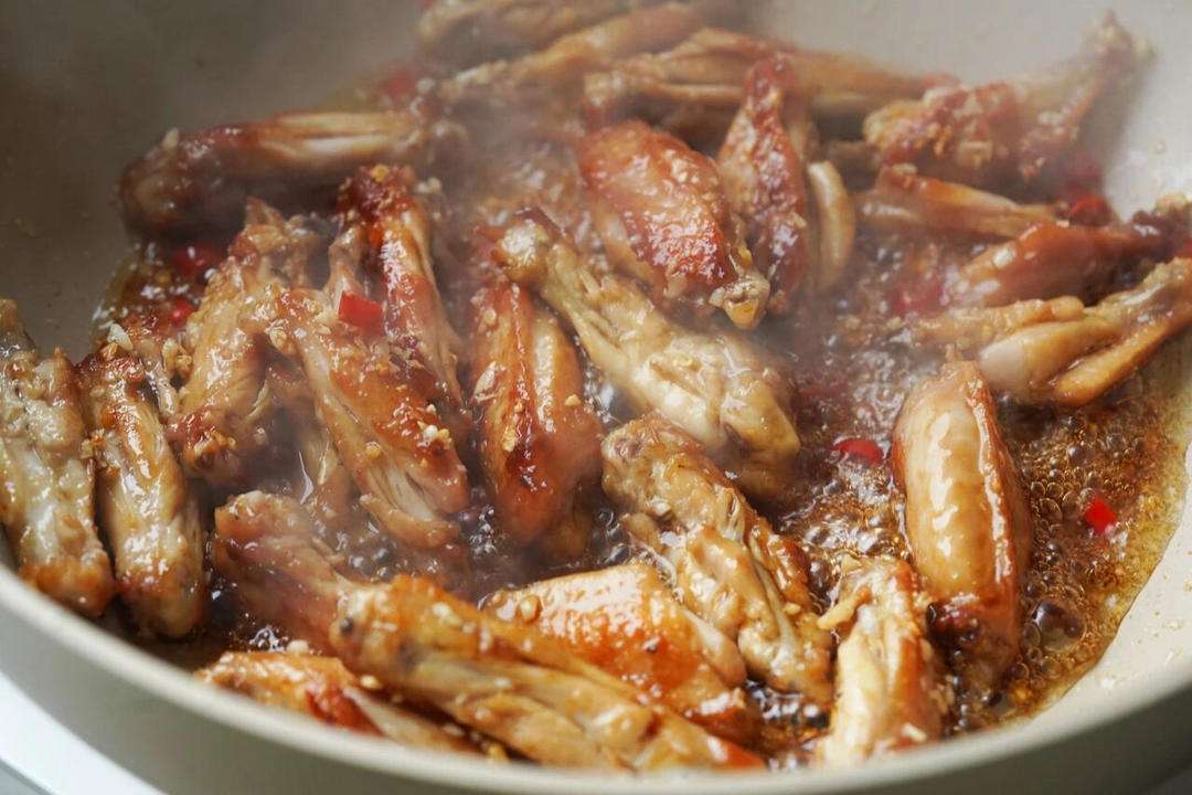 Pan-fry the marinated wings in a single layer until both sides are deeply golden