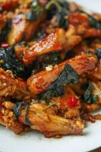 Glaze the wings with soy sauce and sugar until they turn glossy and caramelized