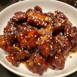 Plum-braised ribs in a glossy sweet-sour sauce