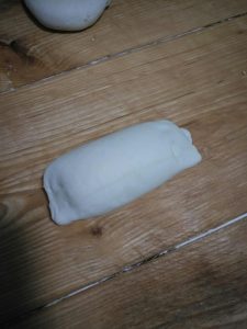 Press the sides of the dough piece gently to seal