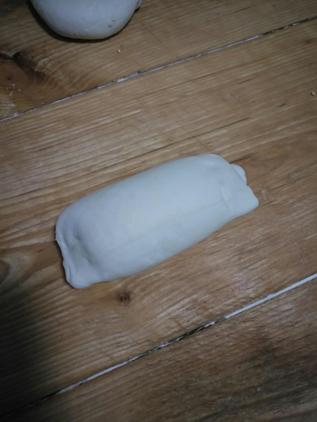 Press the sides of the dough piece gently to seal