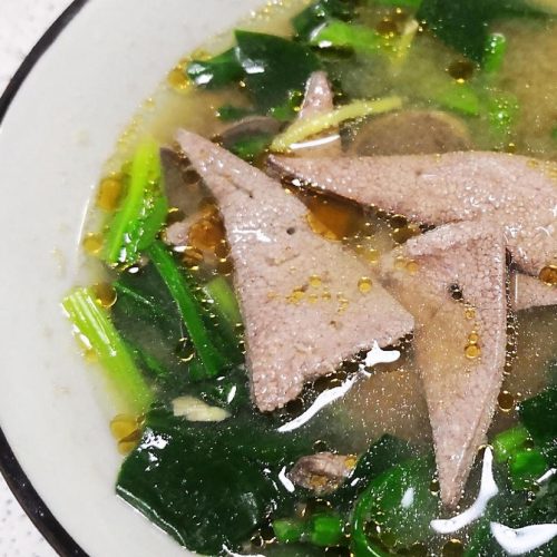 Tender pork liver and spinach soup with velveted liver slices in a gingery broth